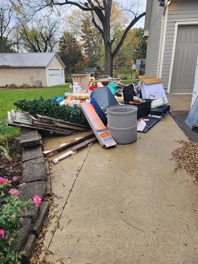 Dumpster being loaded with debris for Demolition Dumpster Rental in Bryn Mawr-Skyway